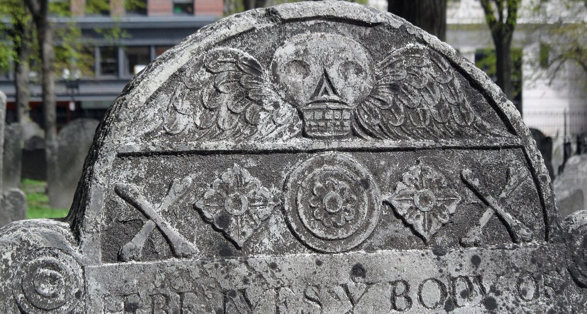 Slate gravestone with a carved winged skull, Granary Burying Ground, Boston.