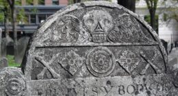 Slate gravestone with a carved winged skull, Granary Burying Ground, Boston.